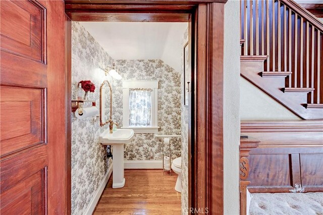 455 W 20th St, Merced, CA 95340 - bathroom with sink, hardwood / wood-style flooring, and toilet
