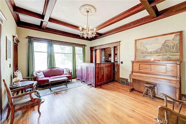 455 W 20th St, Merced, CA 95340 - living area with beam ceiling, coffered ceiling, a chandelier, and light wood-type flooring
