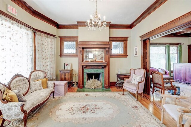 455 W 20th St, Merced, CA 95340 - sitting room with crown molding, light hardwood / wood-style flooring, and a chandelier