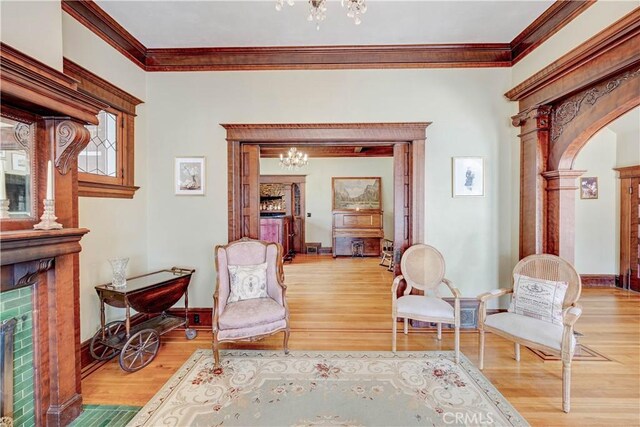455 W 20th St, Merced, CA 95340 - sitting room featuring an inviting chandelier, hardwood / wood-style flooring, and crown molding