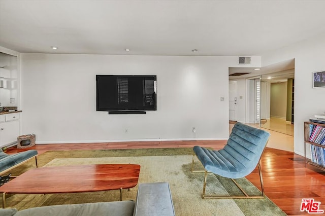 living room with hardwood / wood-style flooring