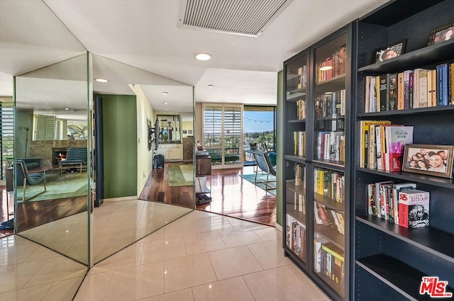 hallway featuring light tile patterned flooring