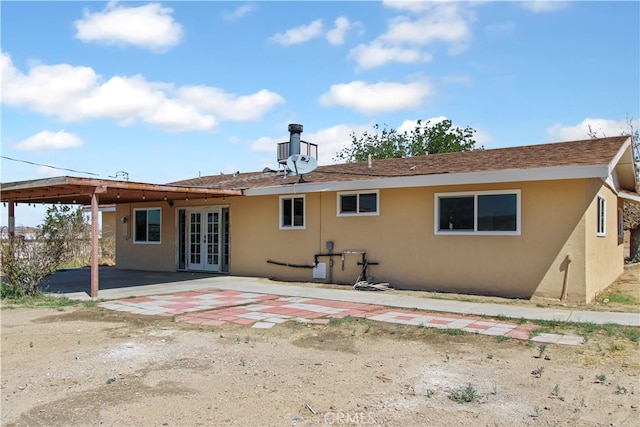 back of house featuring french doors and a patio area