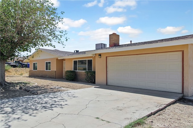 ranch-style home featuring a garage