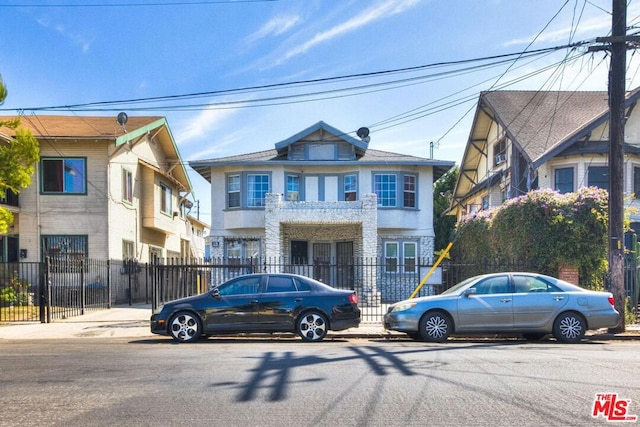 view of front of home featuring a balcony