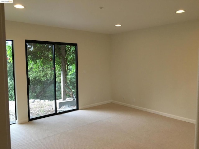 empty room with light colored carpet