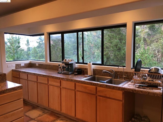 kitchen with light tile patterned floors and sink