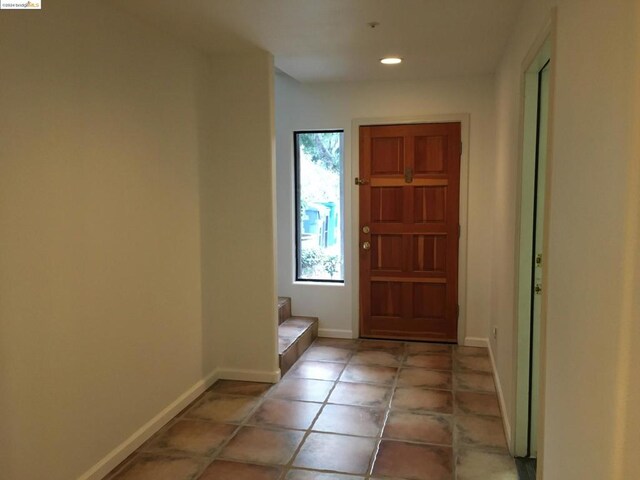 entryway featuring light tile patterned floors