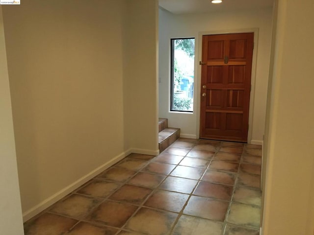 doorway to outside featuring tile patterned floors