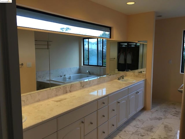 bathroom featuring vanity and a bathtub