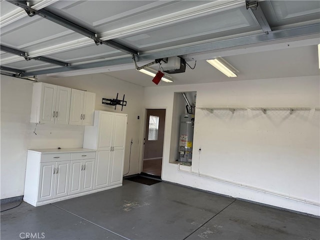 garage featuring a garage door opener and gas water heater