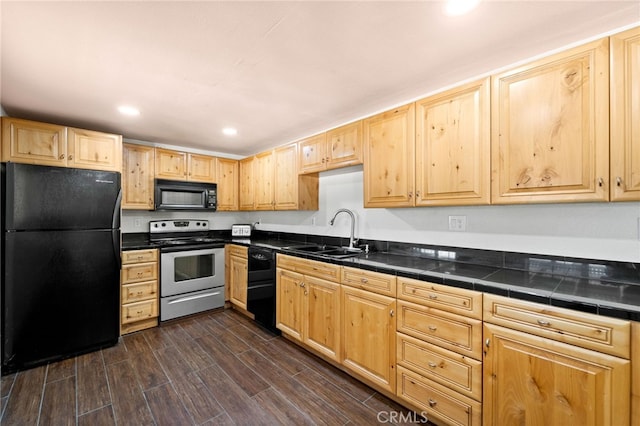 kitchen featuring black appliances, sink, dark hardwood / wood-style flooring, and light brown cabinetry