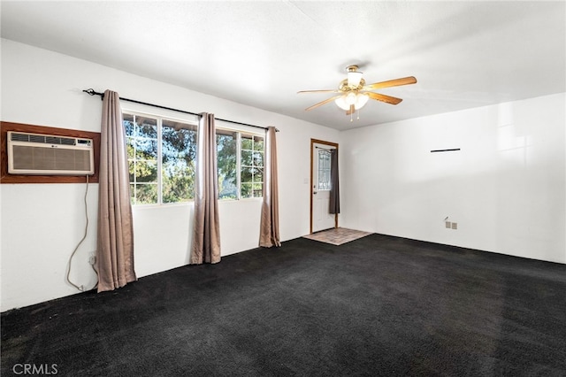 carpeted spare room featuring ceiling fan and a wall mounted AC