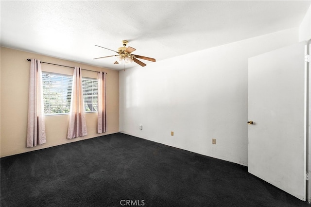 spare room with ceiling fan and carpet floors