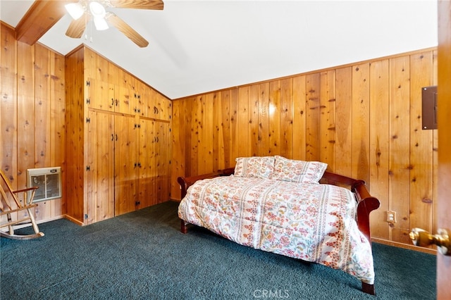 carpeted bedroom with ceiling fan, wood walls, and vaulted ceiling