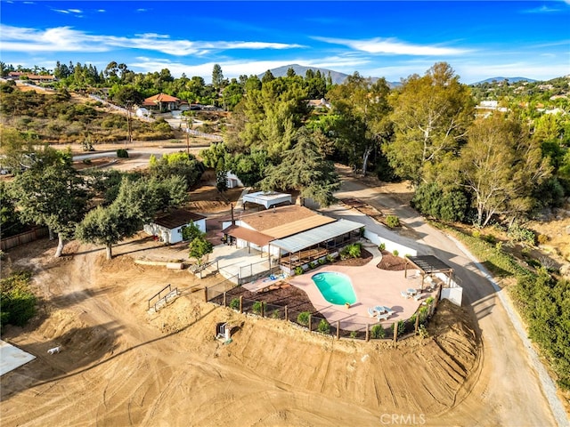 birds eye view of property featuring a mountain view