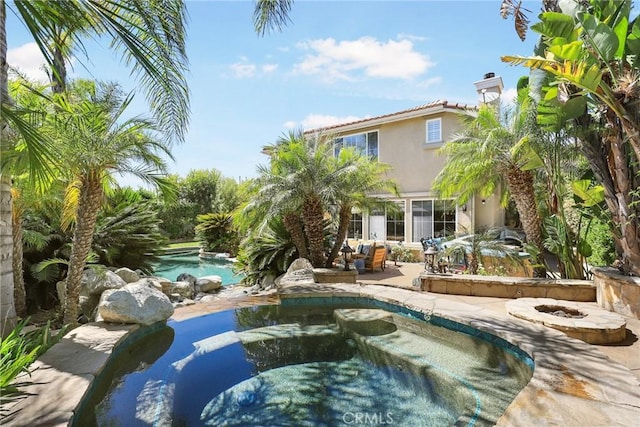 view of pool featuring a patio