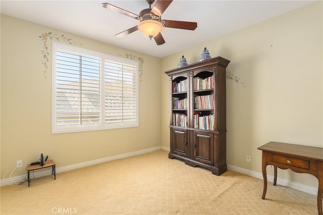 misc room with light carpet and ceiling fan