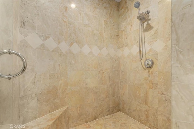 bathroom with tiled shower