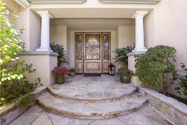 property entrance featuring covered porch