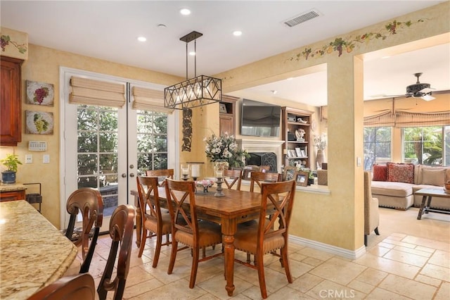 dining room featuring french doors and ceiling fan