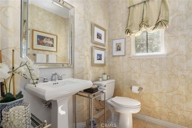 bathroom featuring tile patterned flooring, sink, and toilet