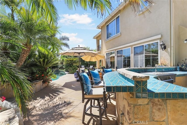 view of patio / terrace with an outdoor bar