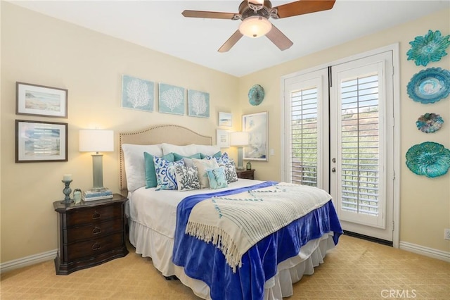 bedroom featuring light colored carpet, access to exterior, and ceiling fan