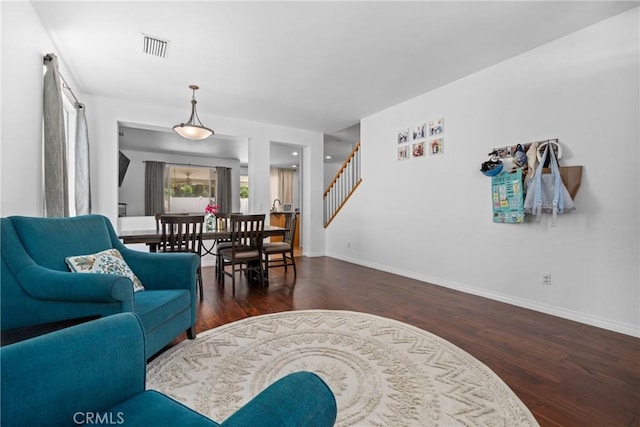 living room featuring dark wood-type flooring