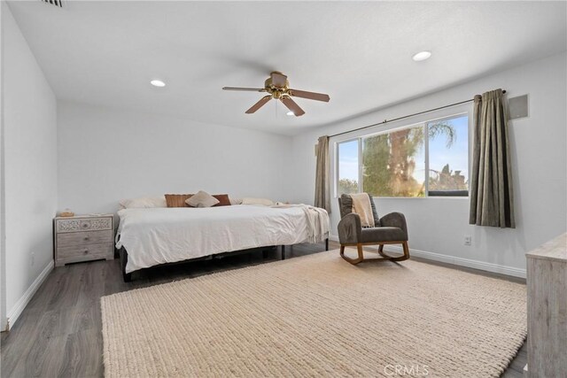 bedroom featuring ceiling fan and wood-type flooring