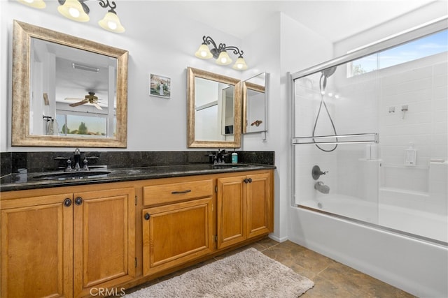 bathroom featuring tile patterned flooring, ceiling fan, dual bowl vanity, and shower / bath combination with glass door