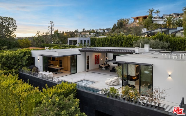 back of house featuring a patio area