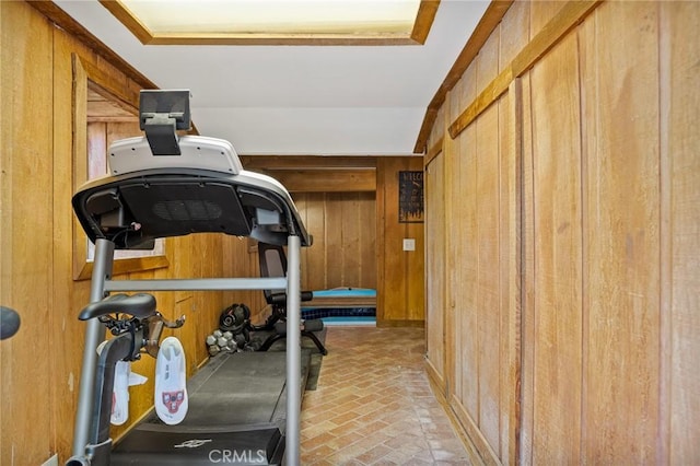 exercise room featuring wooden walls