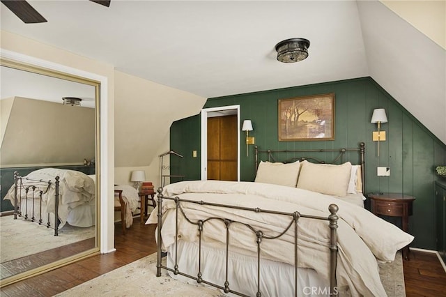 bedroom featuring vaulted ceiling, ceiling fan, and dark hardwood / wood-style floors