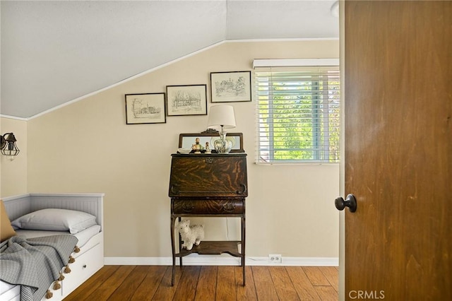 bedroom with hardwood / wood-style floors and vaulted ceiling