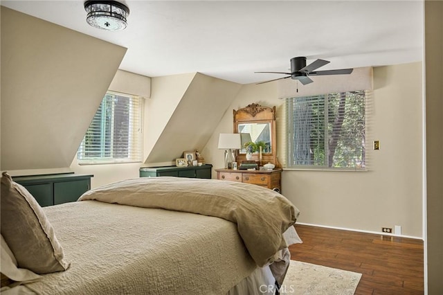 bedroom with lofted ceiling, ceiling fan, and dark hardwood / wood-style floors