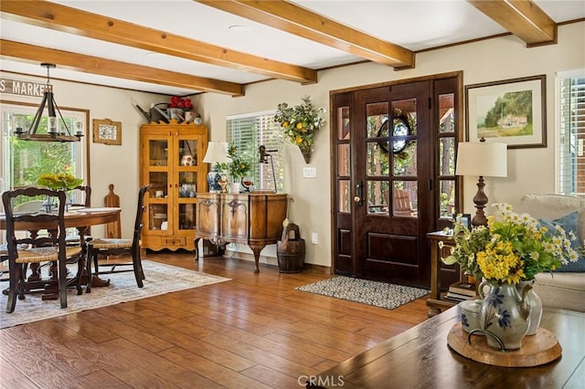 foyer entrance featuring beam ceiling and hardwood / wood-style flooring