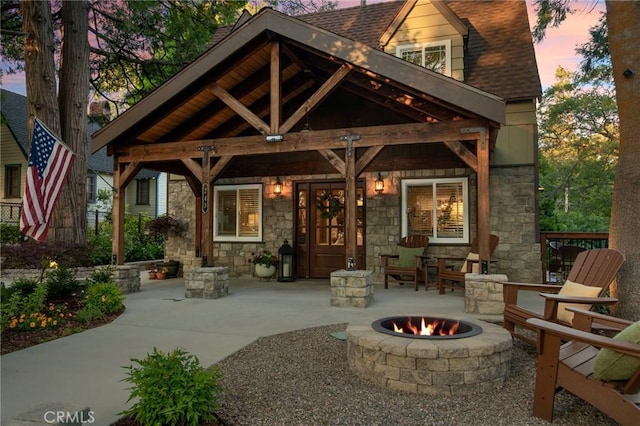 patio terrace at dusk with an outdoor fire pit