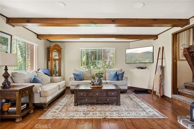 interior space with beamed ceiling and dark wood-type flooring