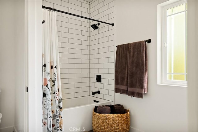 bathroom with shower / tub combo with curtain