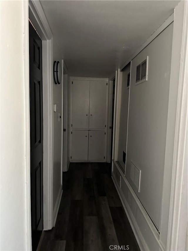 hallway featuring dark hardwood / wood-style floors