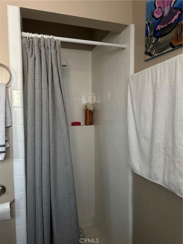 bathroom featuring walk in shower