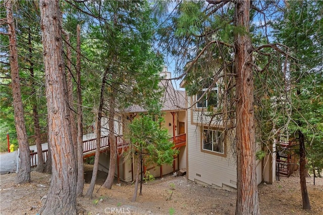 view of property exterior featuring a deck