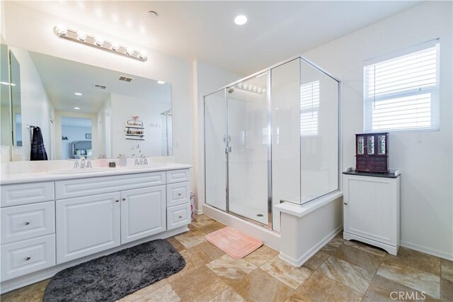 bathroom with vanity, tile patterned flooring, and an enclosed shower