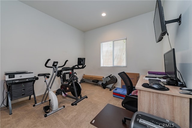 workout area featuring light colored carpet