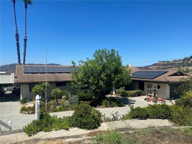 exterior space with solar panels