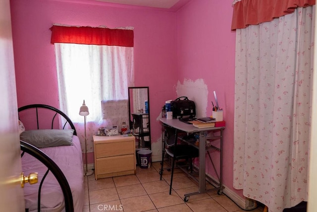 bedroom with light tile patterned flooring