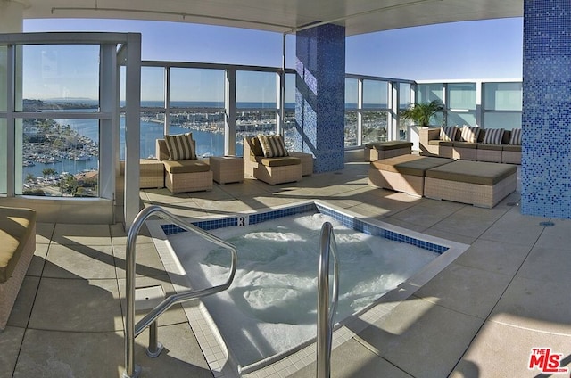 view of swimming pool with a water view and an outdoor hangout area