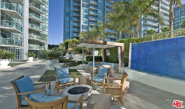 exterior space with a patio area and a fire pit