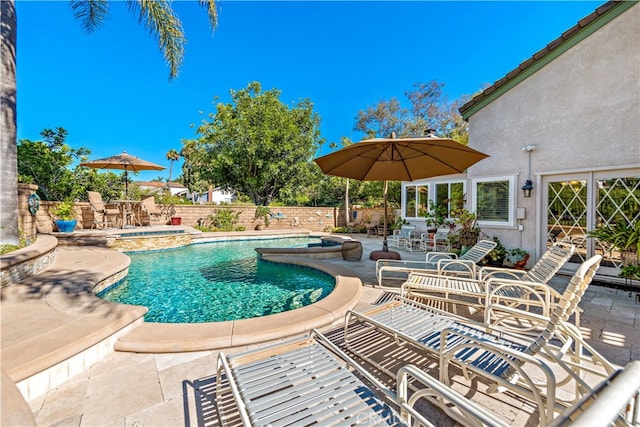 view of swimming pool with a patio